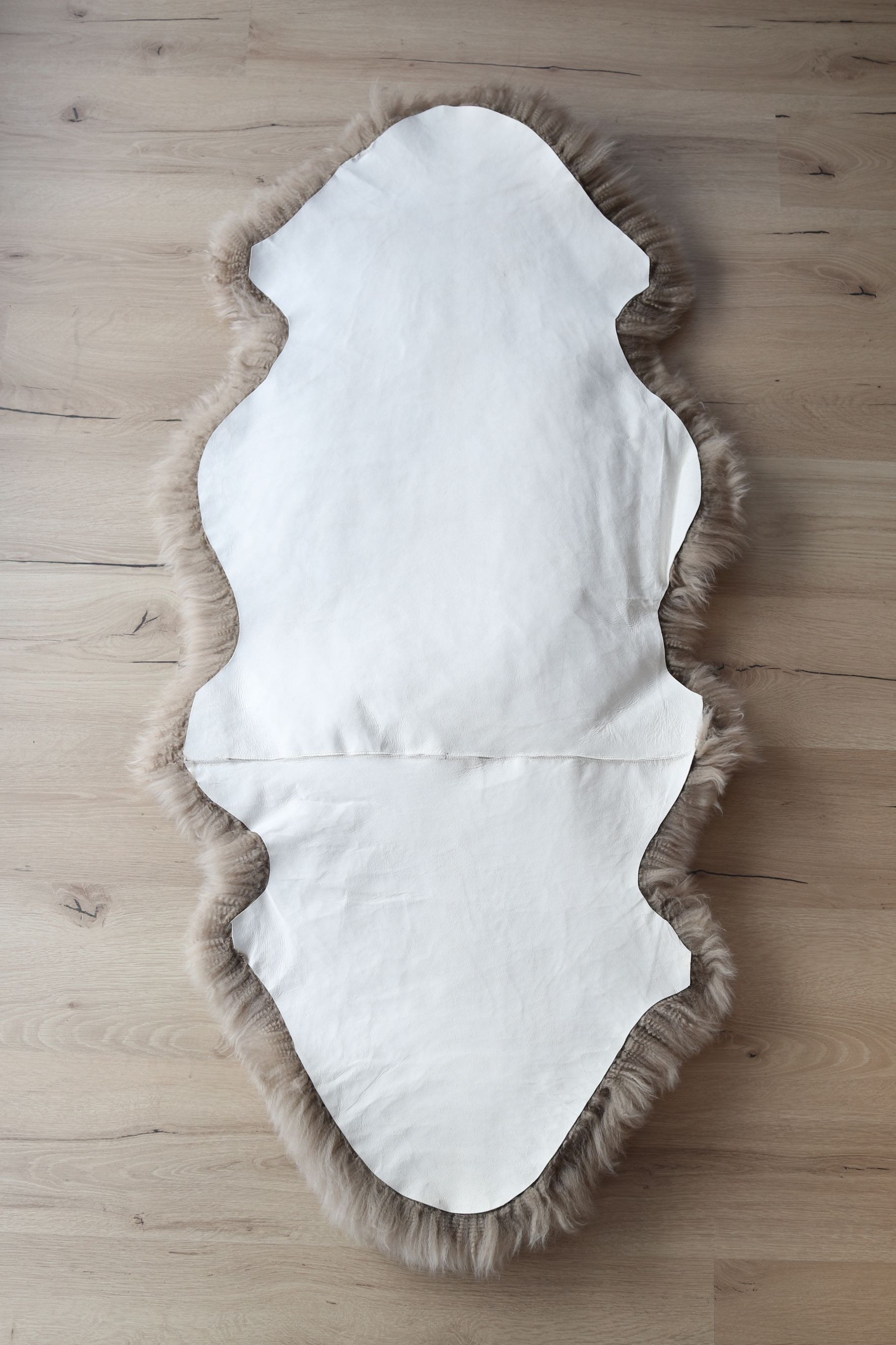 1,5er Lammfell Taupe (grau braun)