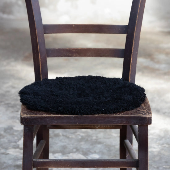 Lammfell Sitzauflage Curly Rund Schwarz