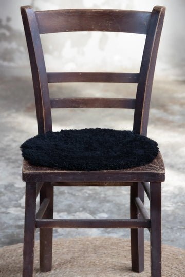 Lammfell Sitzauflage Curly Rund Schwarz